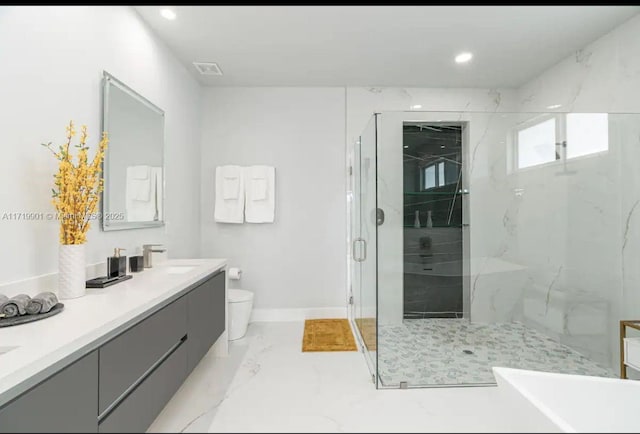 bathroom featuring vanity, an enclosed shower, and toilet