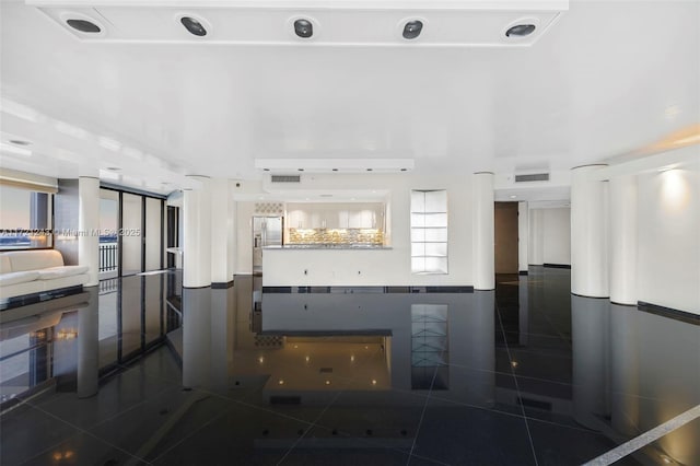 kitchen with decorative backsplash and dark tile patterned flooring