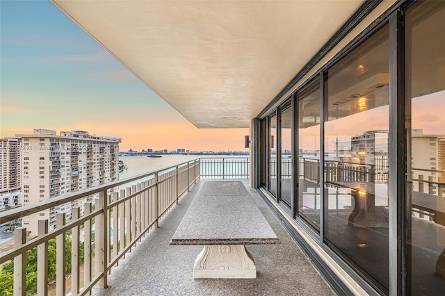 balcony at dusk with a water view