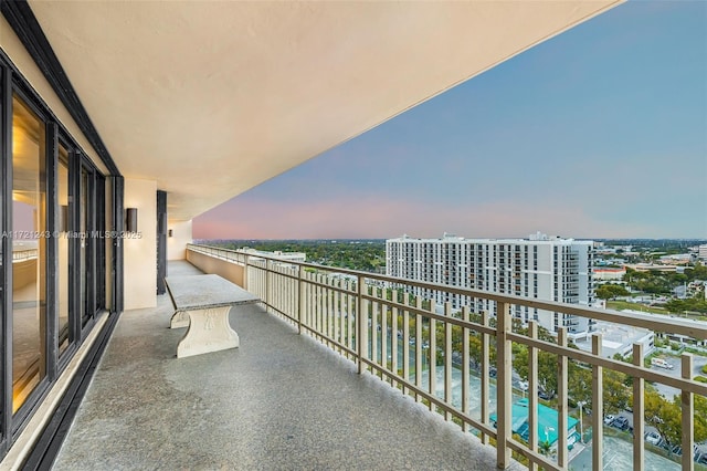 view of balcony at dusk