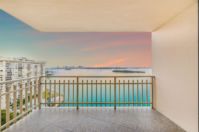 balcony at dusk with a water view