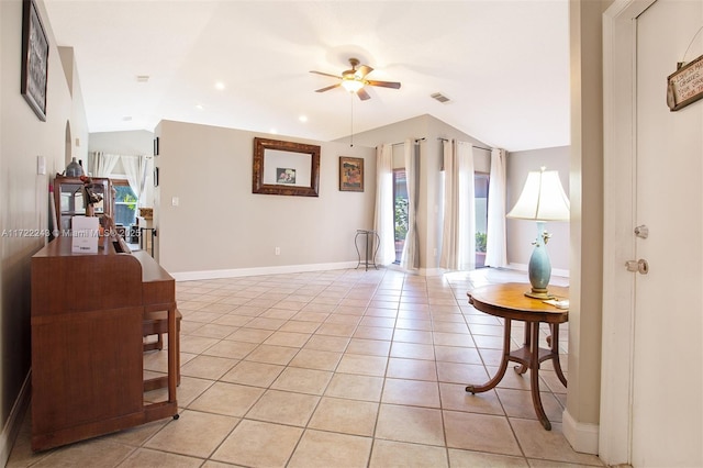 tiled living room with vaulted ceiling and ceiling fan