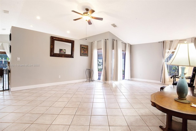 interior space featuring light tile patterned floors, ceiling fan, and lofted ceiling