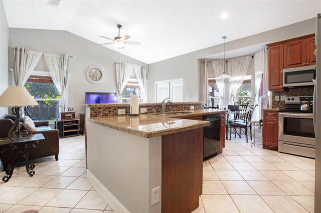 kitchen featuring sink, stainless steel appliances, light stone counters, backsplash, and vaulted ceiling