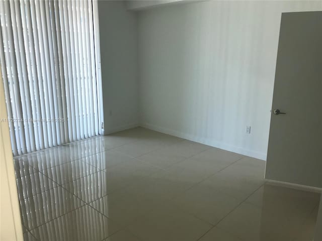 empty room featuring tile patterned floors