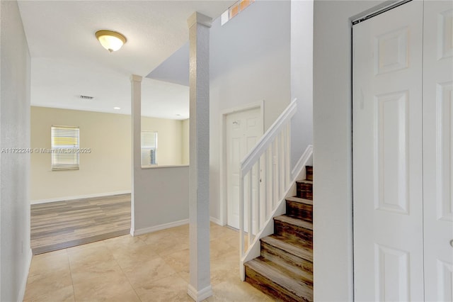 staircase with tile patterned floors