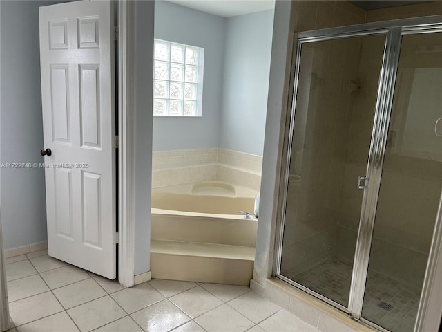 bathroom with tile patterned flooring and independent shower and bath