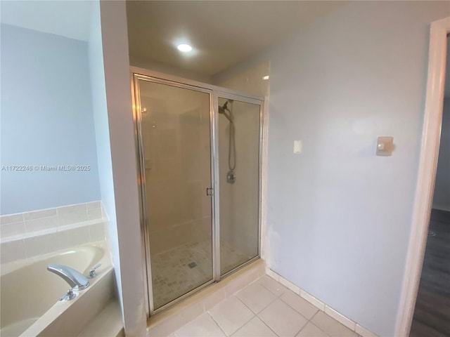 bathroom with tile patterned flooring and plus walk in shower