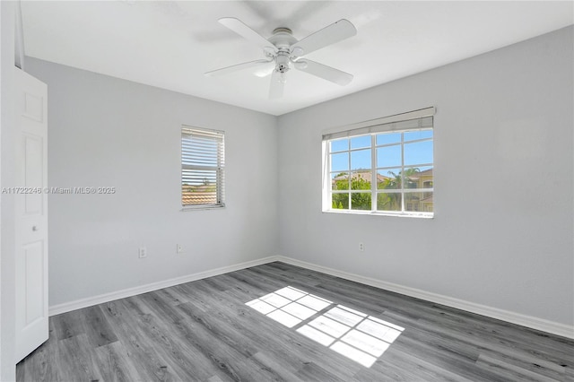 unfurnished room featuring hardwood / wood-style floors and ceiling fan