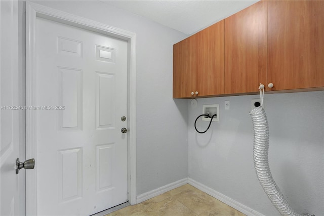 washroom with cabinets, hookup for a washing machine, and electric dryer hookup