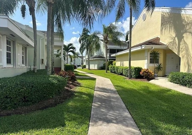 view of home's community featuring a yard