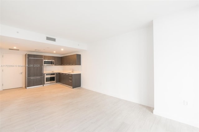 unfurnished living room with sink