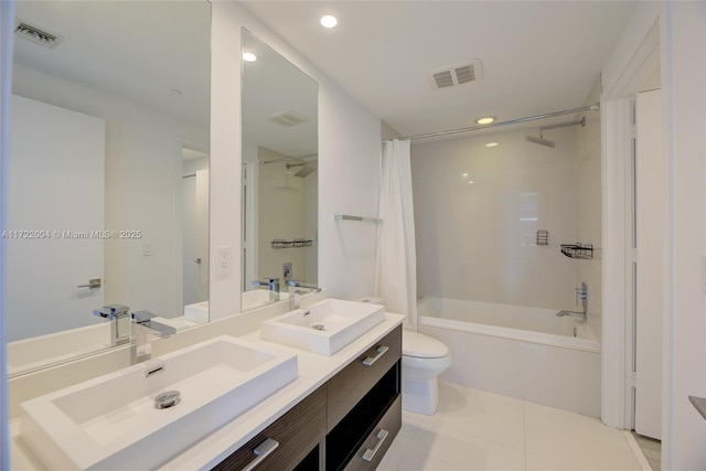 full bathroom featuring tile patterned flooring, vanity, toilet, and shower / tub combo with curtain