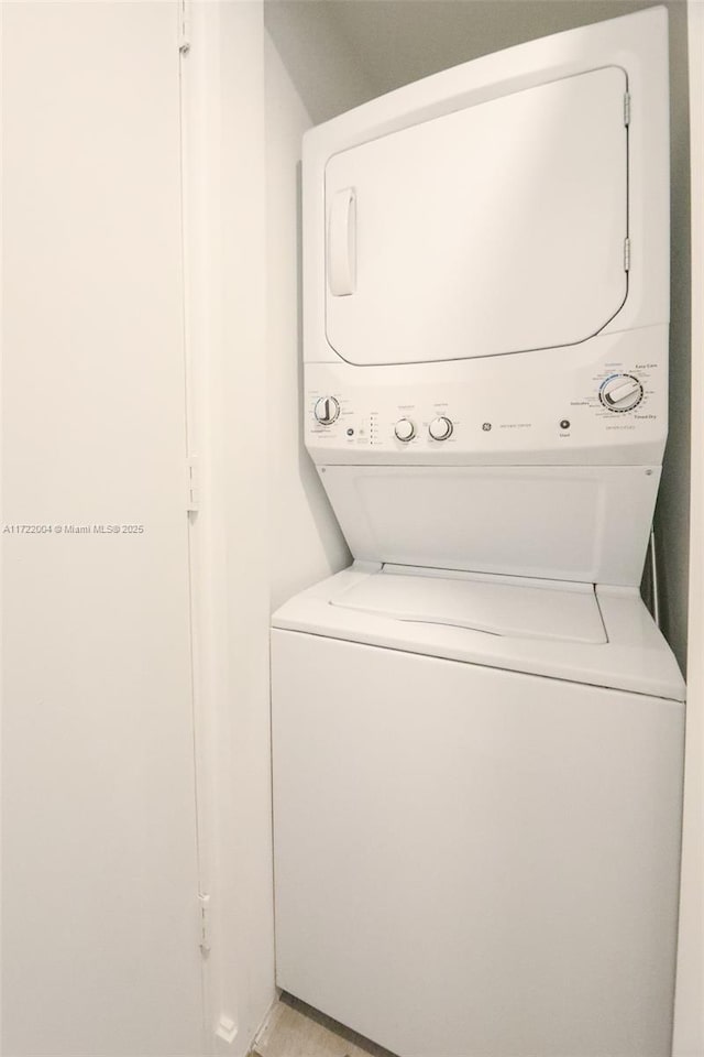 washroom with stacked washer and dryer