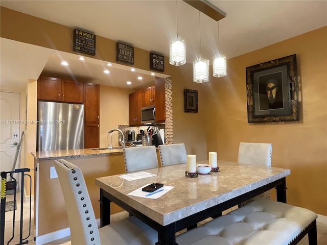 dining room featuring sink