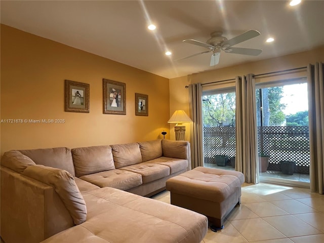 living room with ceiling fan and light tile patterned floors