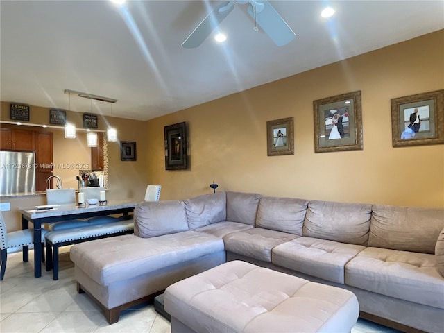 living room featuring ceiling fan and light tile patterned flooring