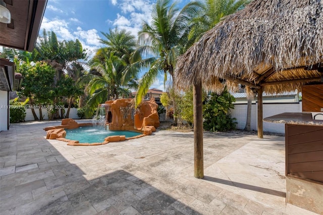 view of patio / terrace featuring a gazebo, pool water feature, and a fenced in pool