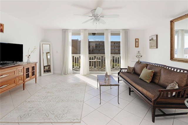 tiled living room with ceiling fan