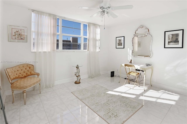 interior space with ceiling fan