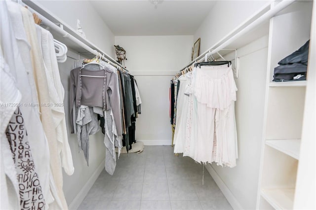 spacious closet featuring tile patterned flooring