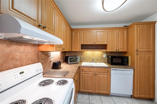 kitchen with a sink, under cabinet range hood, tasteful backsplash, white appliances, and a toaster