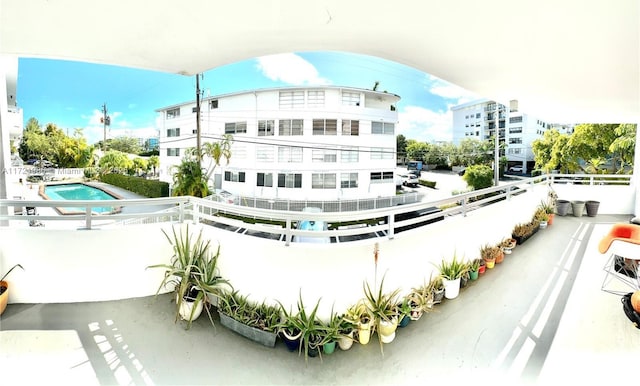 view of building exterior featuring a community pool