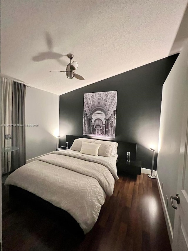 bedroom featuring ceiling fan and dark hardwood / wood-style floors