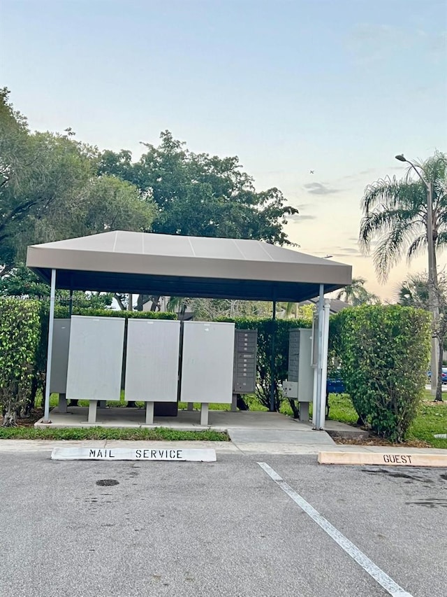 parking at dusk with mail boxes