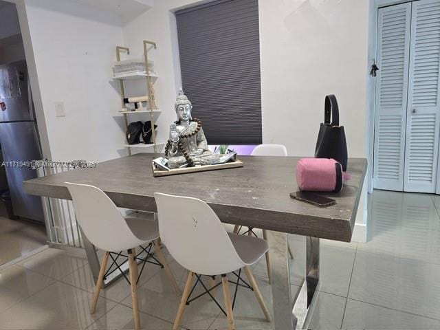 dining room with tile patterned floors