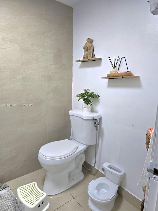 bathroom with tile patterned flooring and toilet