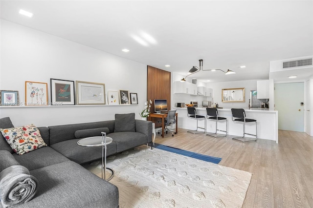 living room featuring light wood-type flooring