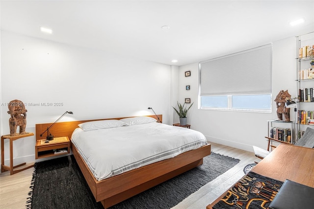 bedroom with light wood-type flooring