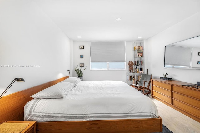 bedroom featuring hardwood / wood-style flooring