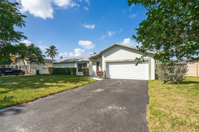 ranch-style home with a front lawn and a garage