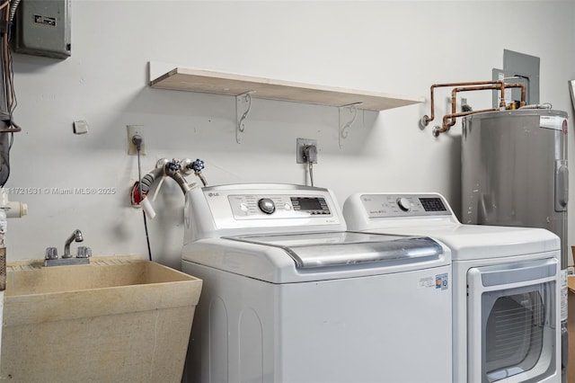 laundry area with independent washer and dryer and sink