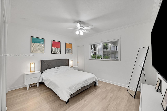 bedroom with crown molding, ceiling fan, and light hardwood / wood-style flooring