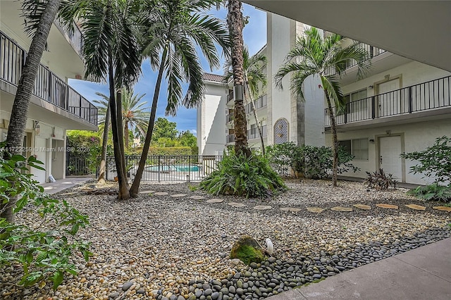 exterior space featuring a fenced in pool