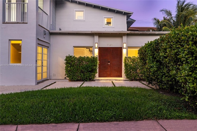 view of front of house with a lawn