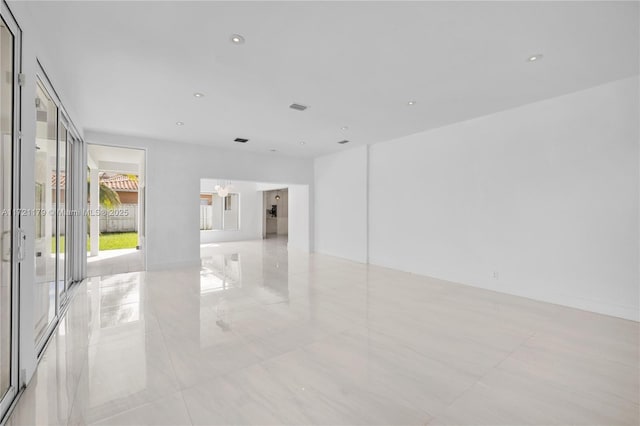 unfurnished room featuring french doors