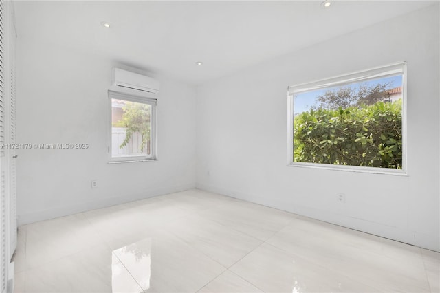 spare room featuring a wall mounted air conditioner