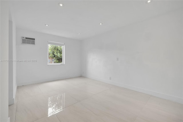 empty room featuring a wall unit AC