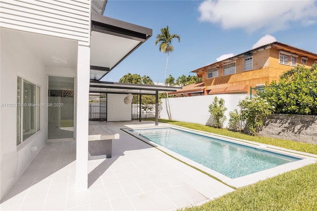 view of swimming pool with a patio area