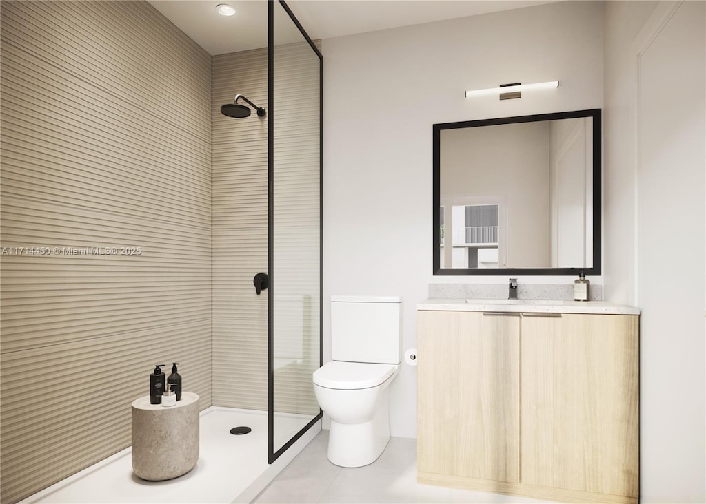 bathroom with a tile shower, vanity, and toilet