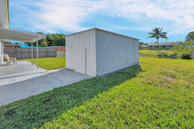 view of outbuilding featuring a lawn