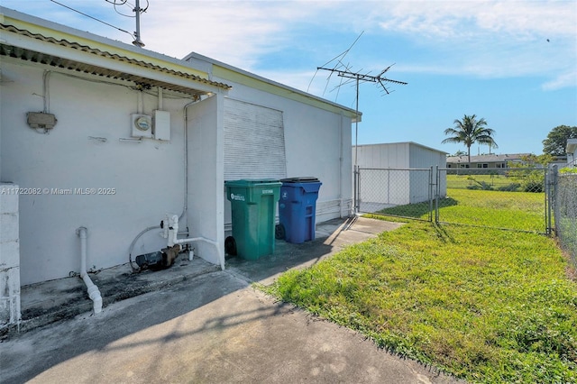 view of property exterior with a yard