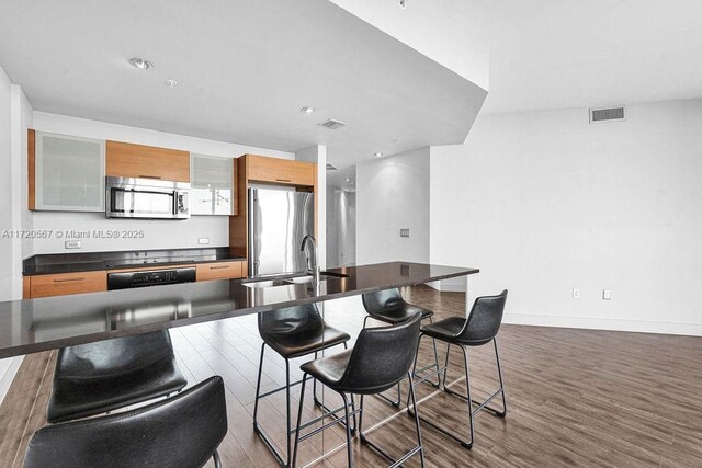 interior space with floor to ceiling windows, a chandelier, and dark hardwood / wood-style floors