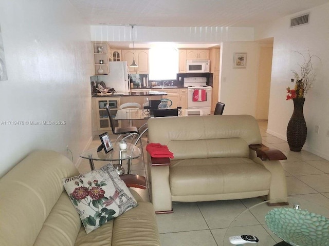 living room featuring light tile patterned floors