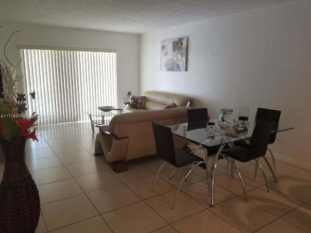 dining area with light tile patterned flooring