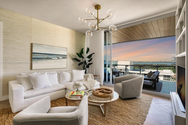 living room with parquet floors and a notable chandelier